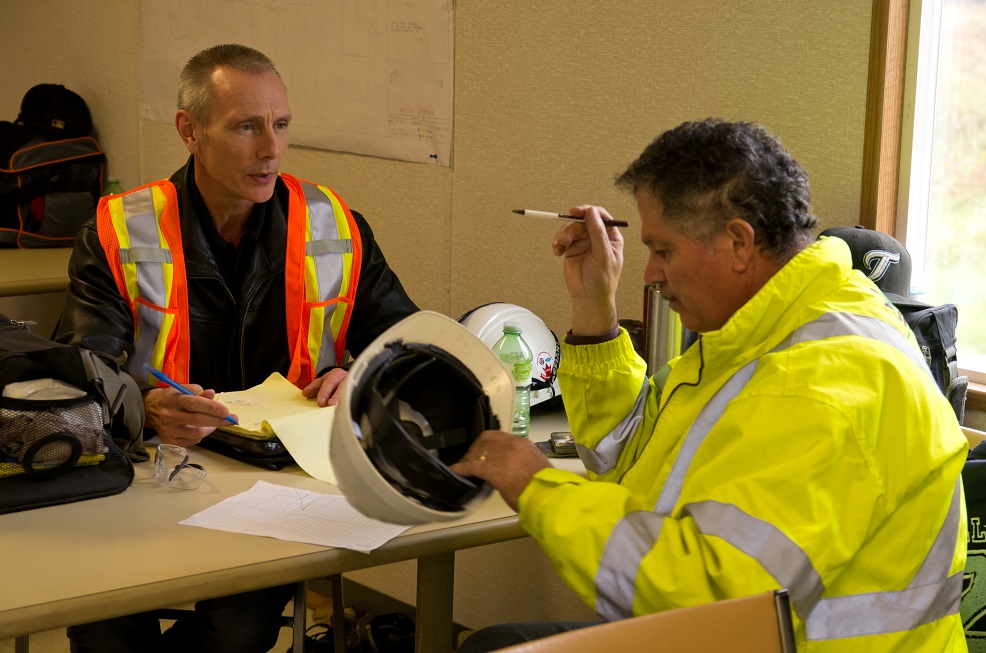 Two QM Employees Having a Meeting