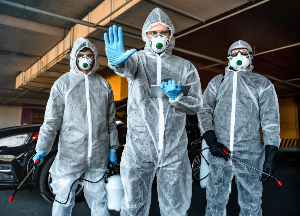 Stop-the-spread QM Employees on Hazmat Suits